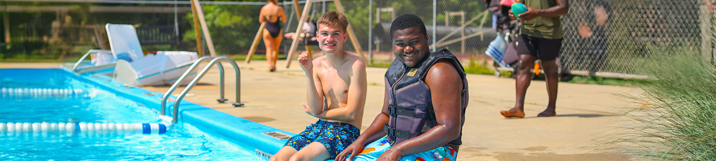 Adult Campers relaxing at the pool
