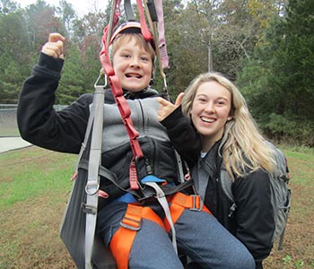 A student and counselor smiling for camera.