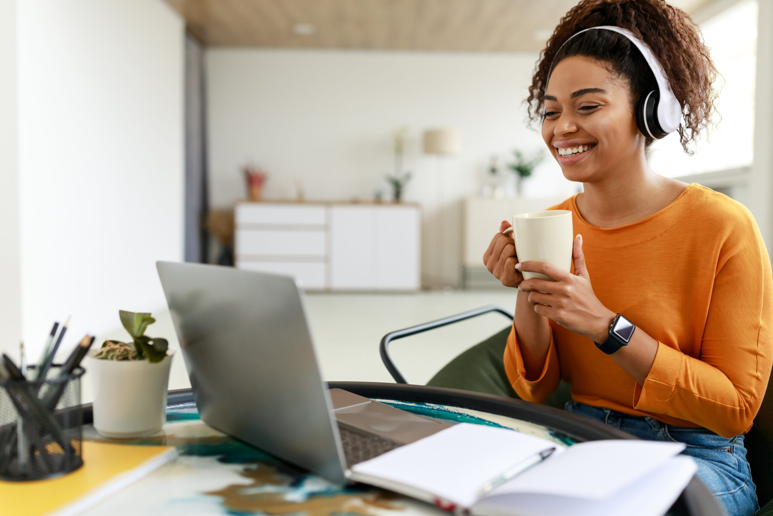 Adult woman with Autism An autistic adult who is enjoying coffee and working from home.