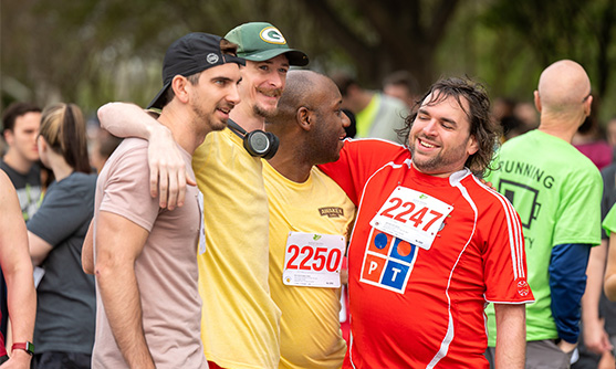 Runners hug after an ASNC Walk/Run event