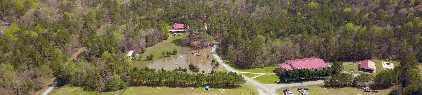 Aerial picture of Camp Royall surrounded by acres of green forest.