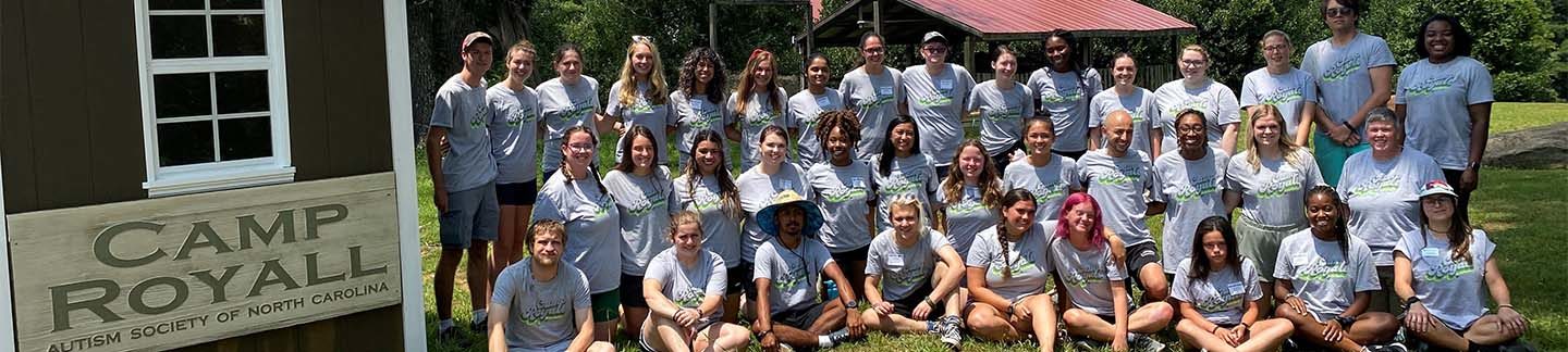 A group shot of camp counselors together in the sun.