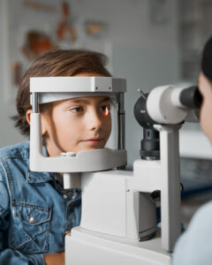 An autistic child having their eyes examined.