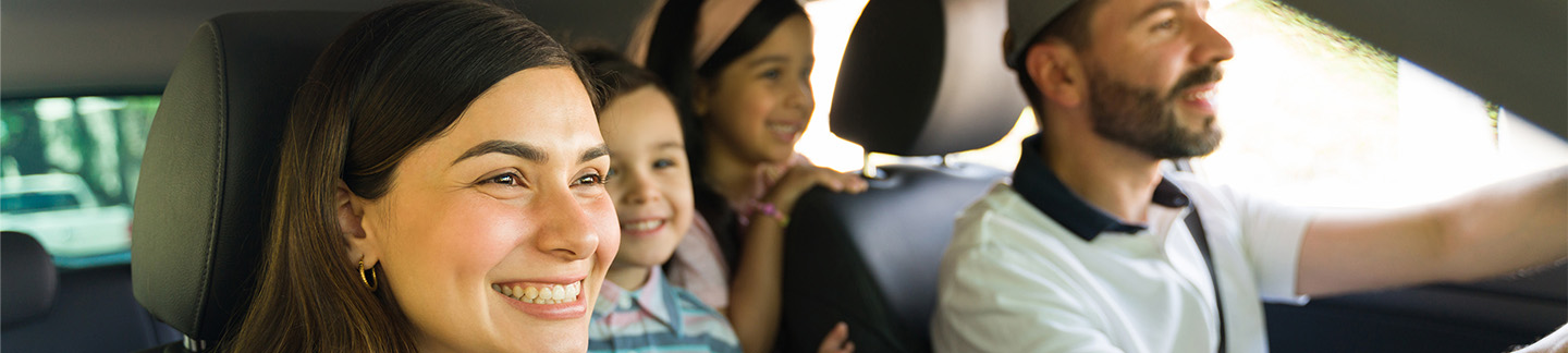 A family in the car on a family outing.