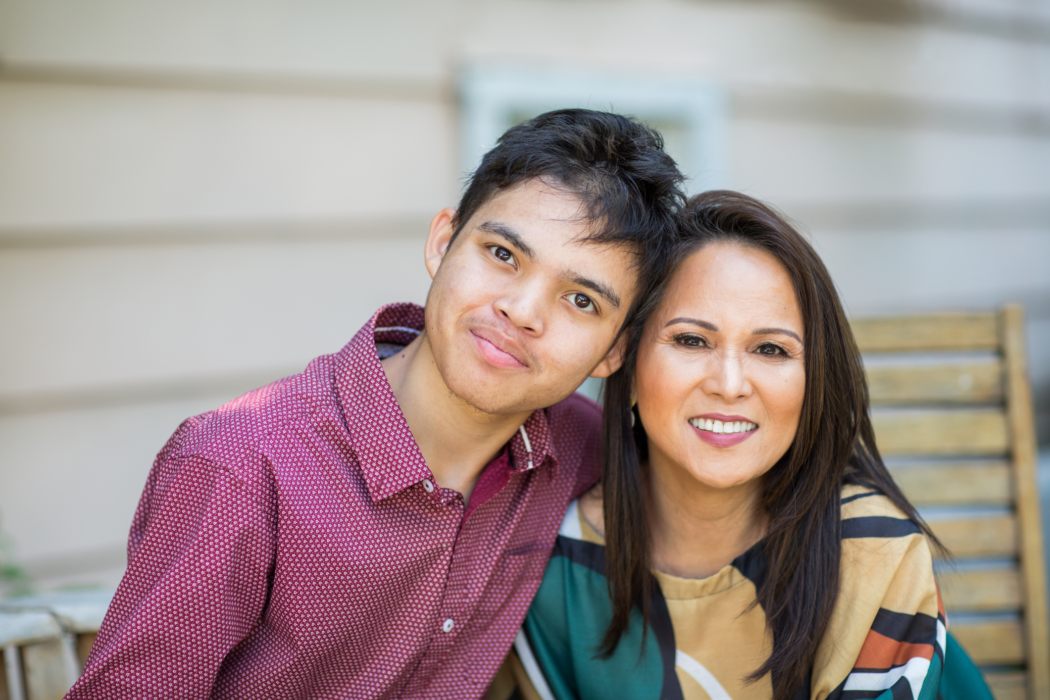 mother smiling with her teenage son.