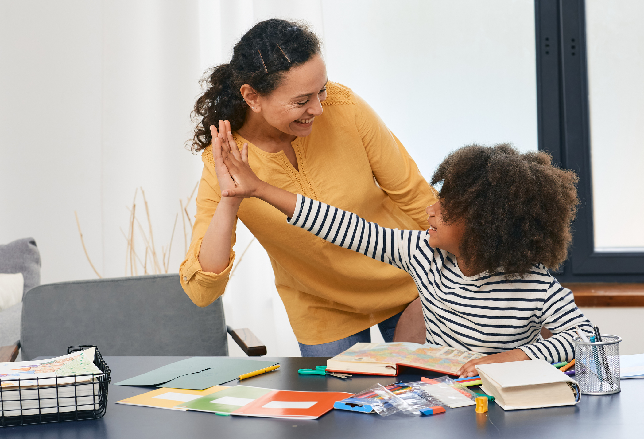 A mother working on homework with her autistic child.