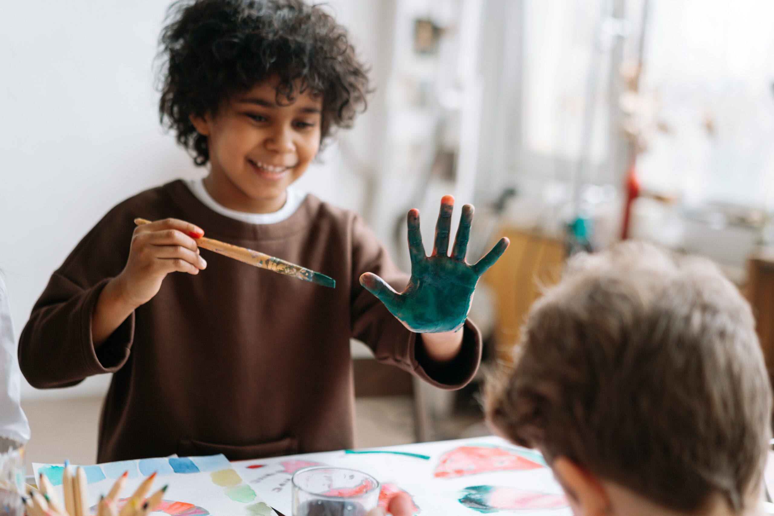 A small boy with pant on his hands